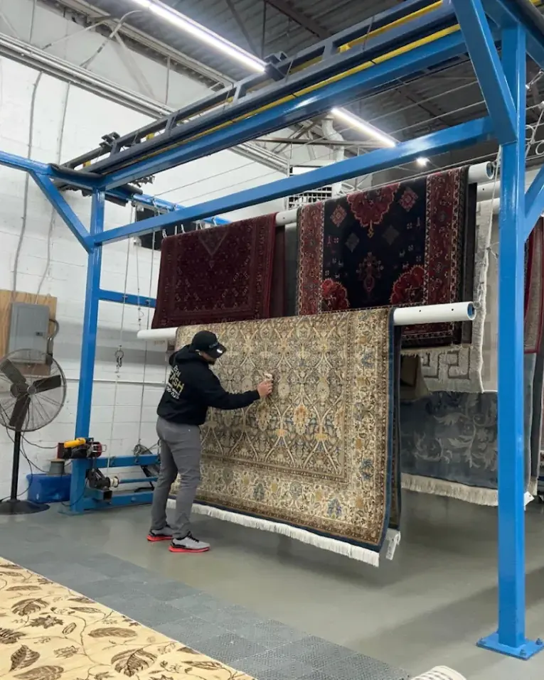 Oriental rugs hanging to dry at the Bear Carpet Care facility